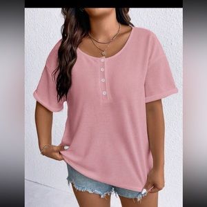 Short sleeve casual shirt. Longer in length. Light pink. Too big for me.